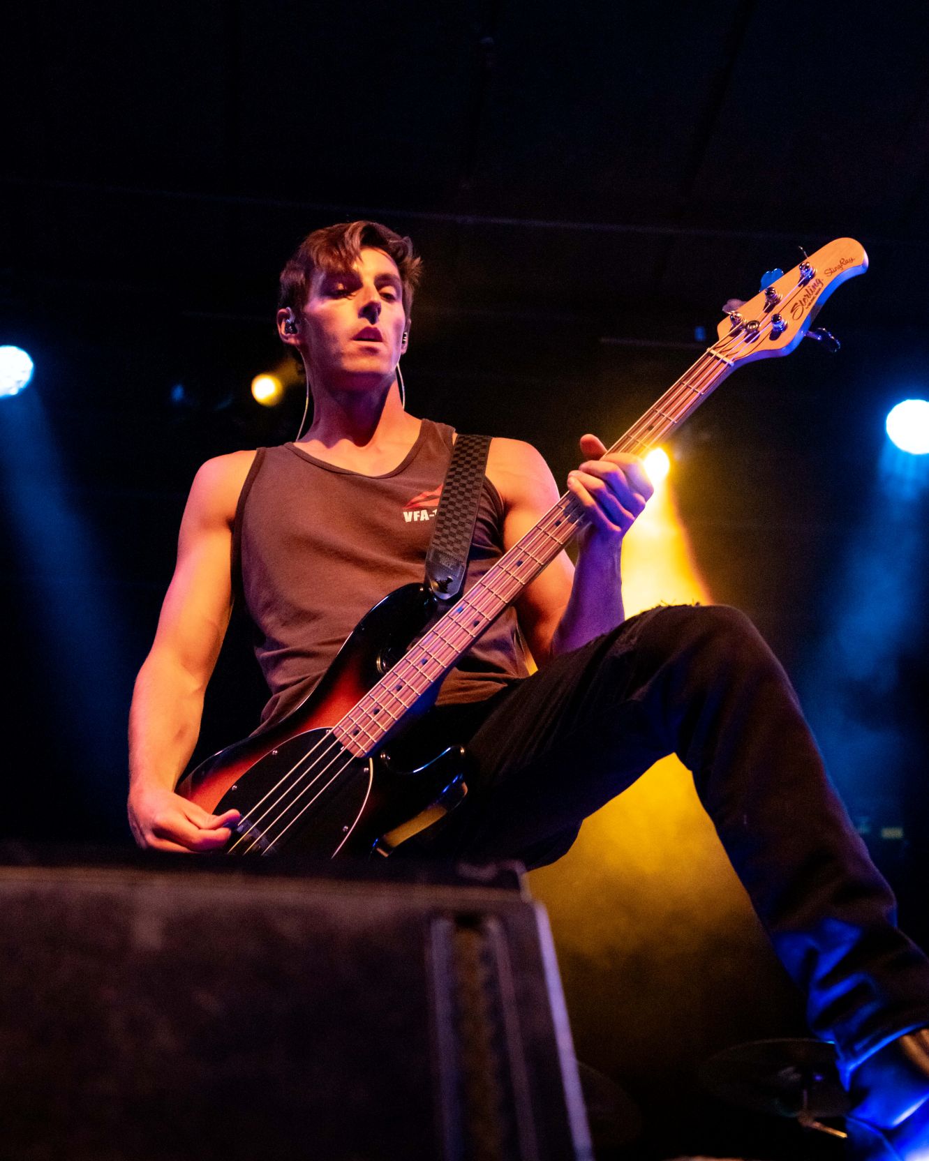 Tyler of Shutter Rattler on stage playing bass.