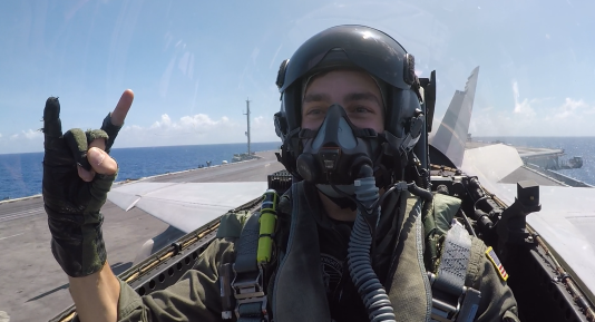 Tyler of Shutter Rattler taking off an aircraft carrier in an F/A-18F Super Hornet